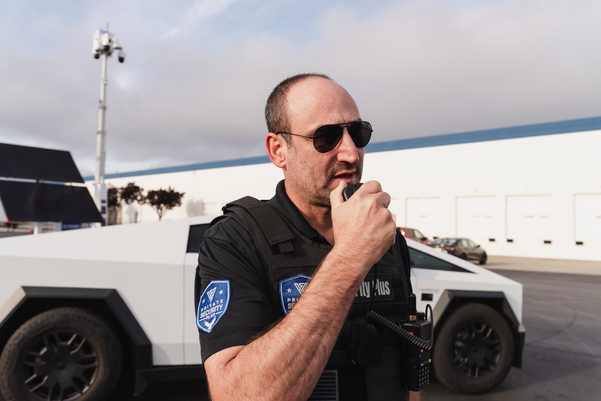 PSP security guard reporting an incident by radio during a property patrol