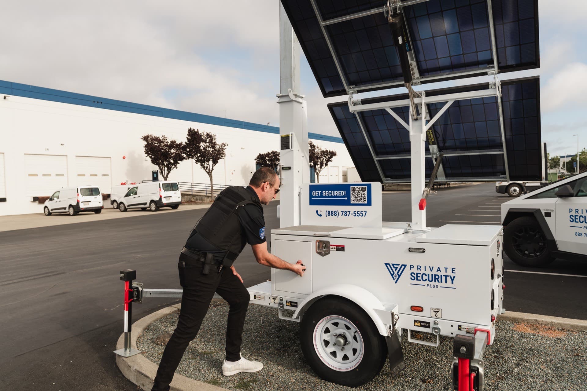 PSP guard operating an AI camera tower at an industrial facility